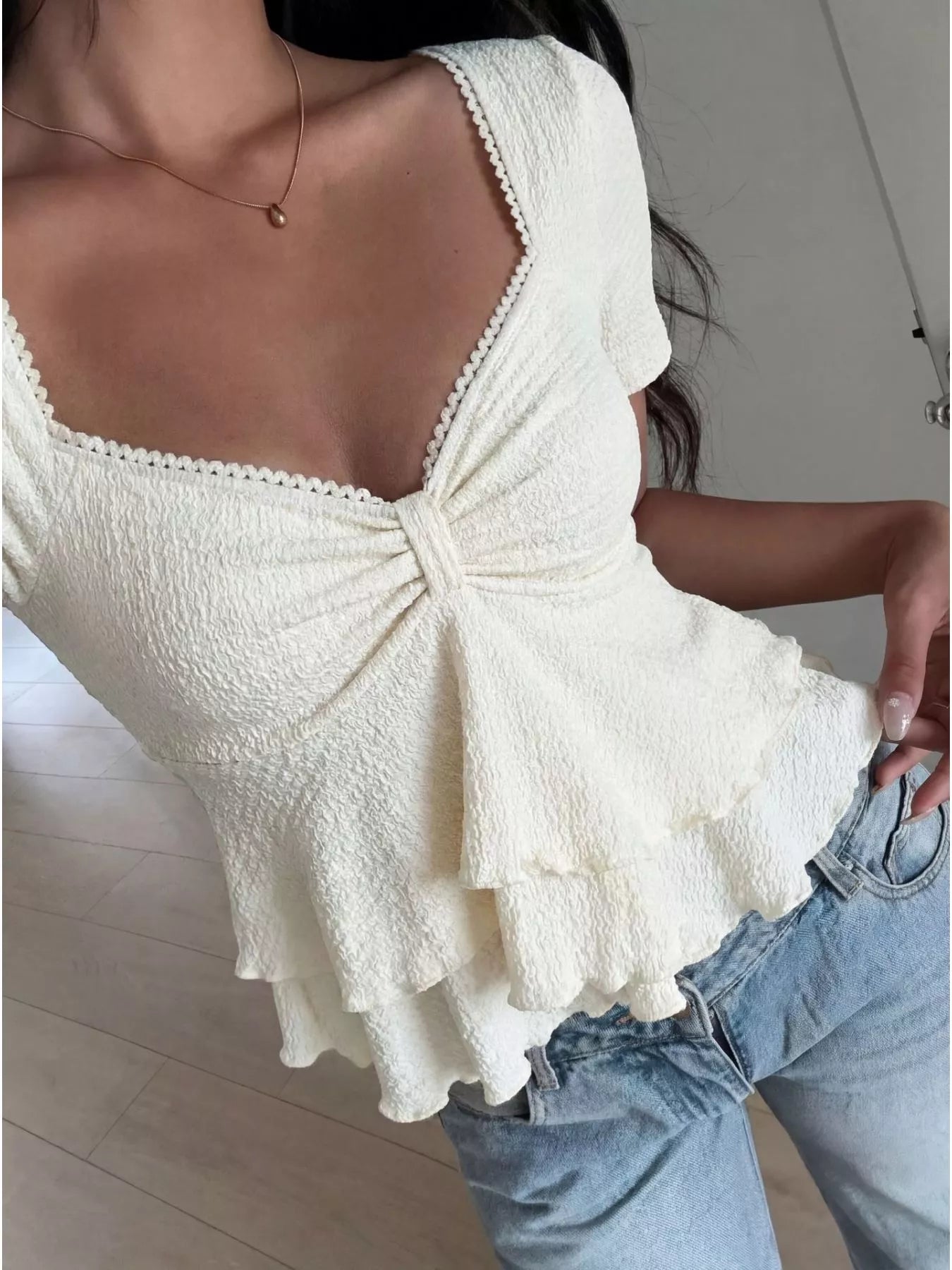 Sweetheart neck layered ruffle top from Trendsi, featuring a feminine design with ruffles and a flattering neckline.