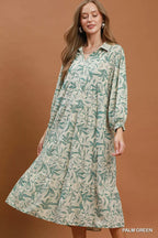 Umgee linen botanical print tiered midi dress with flowy fabric and sleeveless design, perfect for warm weather and casual occasions.