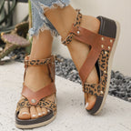 Women's leopard print ankle strap wedge sandals by Trendsi, featuring comfortable summer footwear design with stylish animal print.