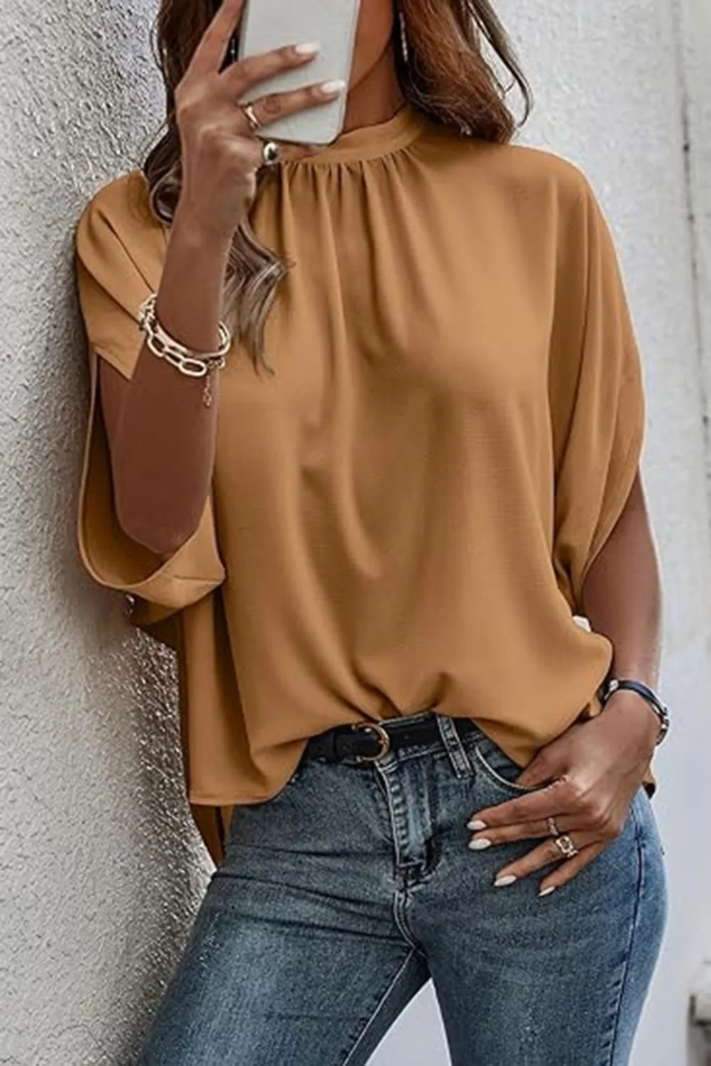Elegant Trendsi tie-back half-sleeve blouse with side slit, showcasing lightweight fabric and stylish design.