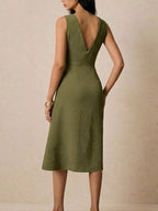 Asymmetrical neck ruched midi dress by Trendsi, featuring a fitted bodice and elegant draping, perfect for stylish occasions.