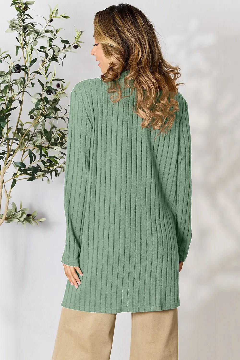Women's lightweight ribbed open front cardigan with functional pockets, stylish and cozy for casual wear by Trendsi.