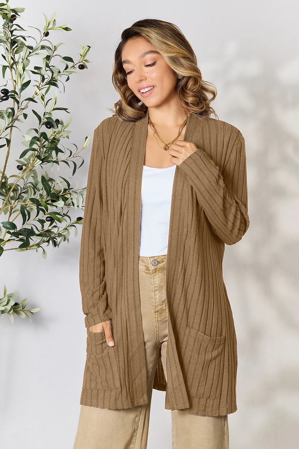 Women's ribbed open front cardigan with functional pockets, lightweight and cozy, stylish layering piece from Trendsi.