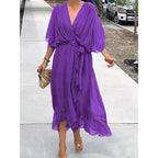 Plush Fashion Hub Batwing Sleeve V-Neck Midi Dress with tied irregular hem, flowing fairy dress style, perfect for elegant occasions.