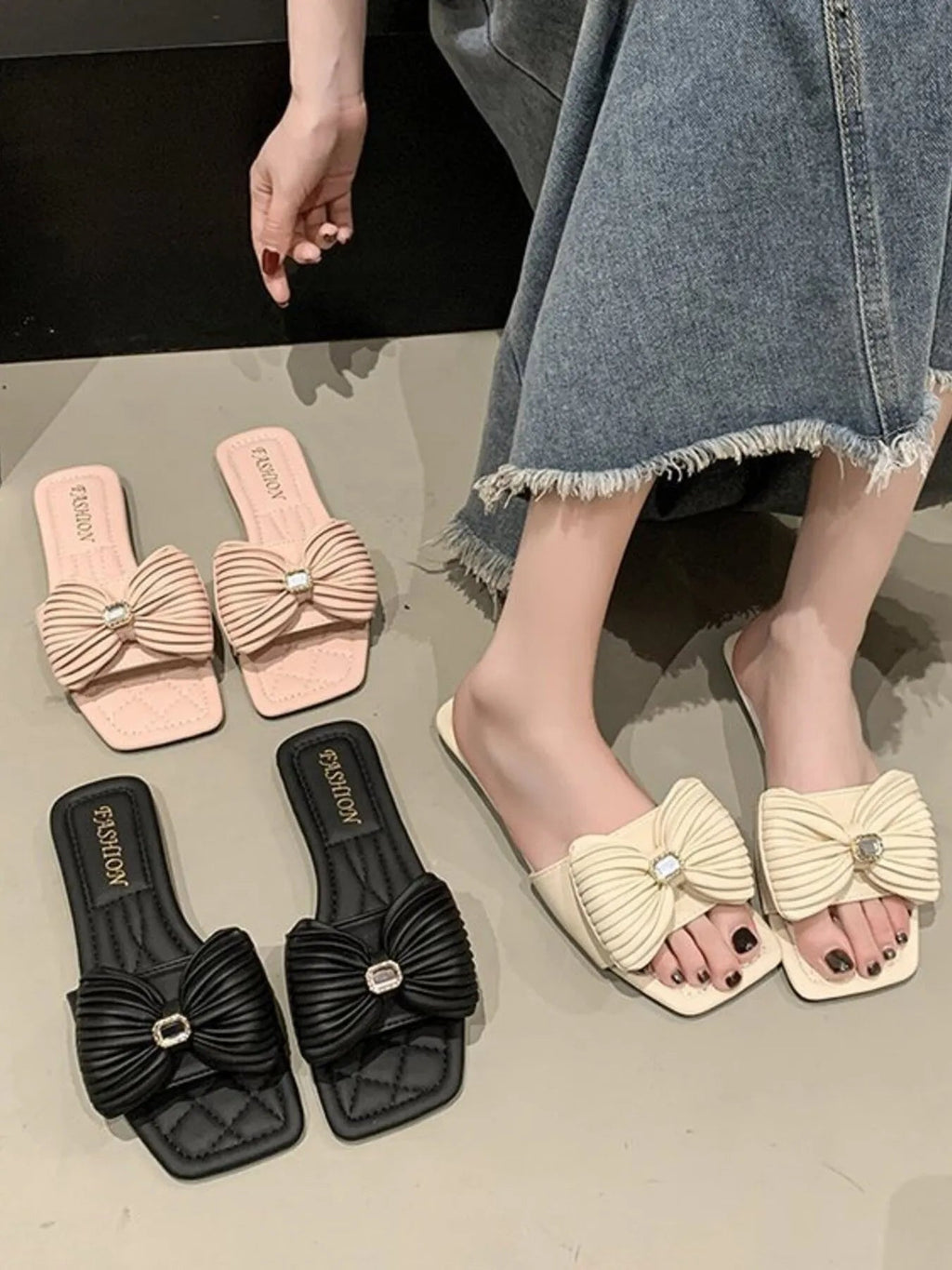Women's faux leather flat sandals with bow-knot detail, stylish and elegant footwear by Trendsi.