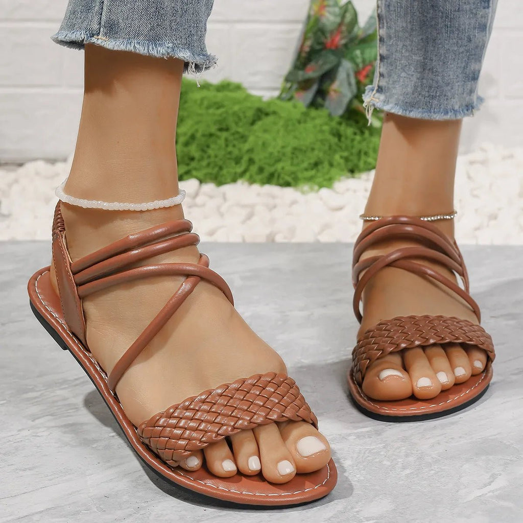 Braided ankle strap flat sandals with comfortable PU leather for casual summer wear, featuring a stylish and supportive design.