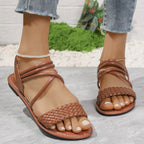 Braided ankle strap flat sandals with comfortable PU leather for casual summer wear, featuring a stylish and supportive design.