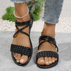 Brown braided ankle strap flat sandals from Trendsi featuring comfortable PU leather and casual summer shoe design.
