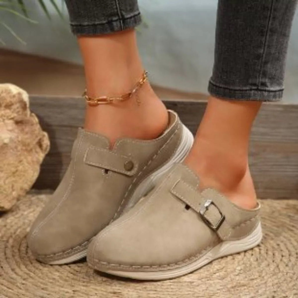 Women's slip-on flats with buckle accents in premium PU leather by Trendsi, showcasing stylish and comfortable shoe design.
