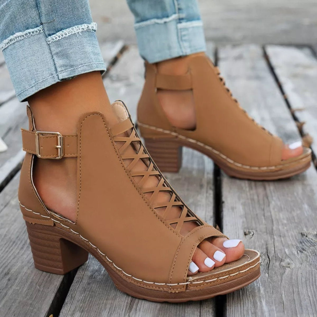 Women's faux leather buckle block heel sandals with mid-height heels, stylish and comfortable for casual or dressy occasions.