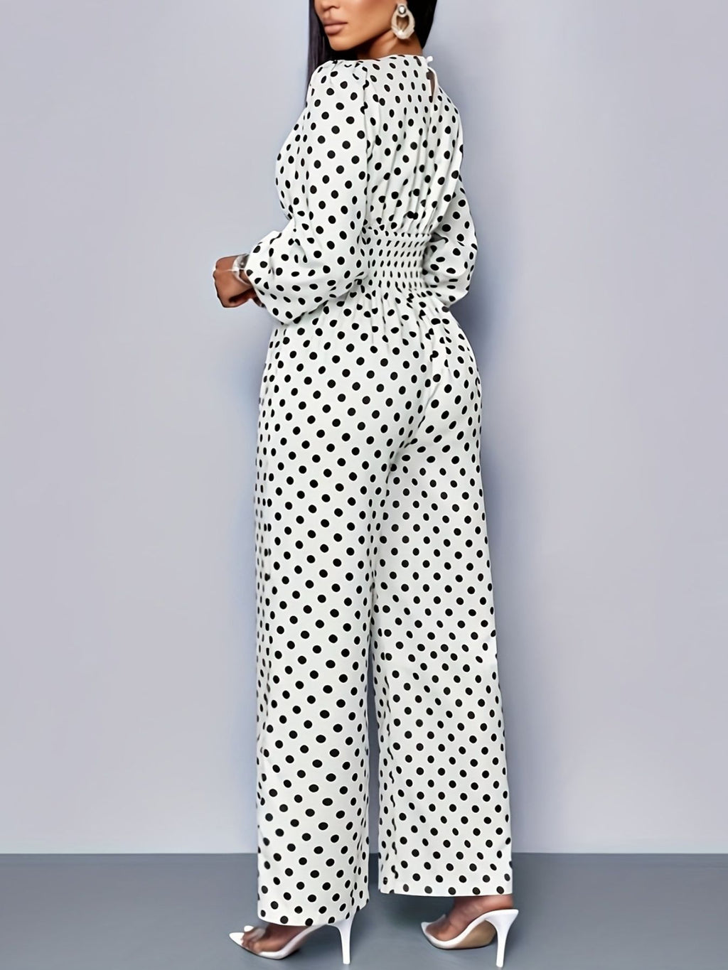 Women's polka dot long sleeve wide leg jumpsuit with pockets, stylish and comfortable Trendsi jumpsuit, full-length view.