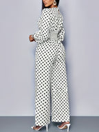 Women's polka dot long sleeve wide leg jumpsuit with pockets, stylish and comfortable Trendsi jumpsuit, full-length view.
