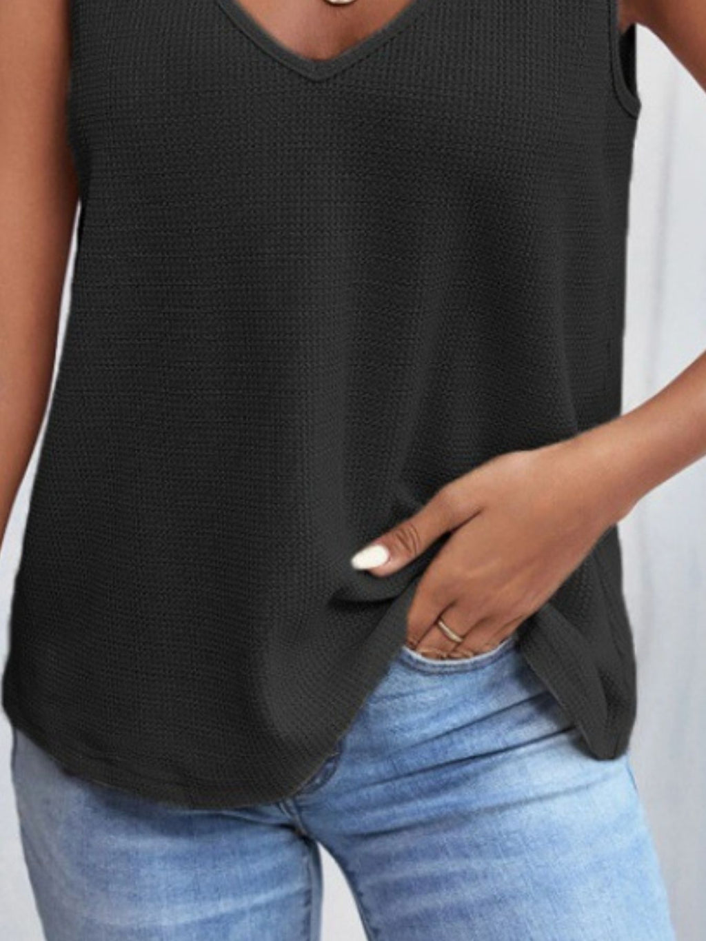 Women's waffle knit tank top with v-neck and lace trim, stylish and comfortable sleeveless top from Trendsi.