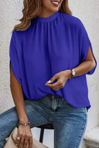 Elegant Trendsi tie-back half-sleeve blouse with side slit, featuring a stylish design and comfortable fit.