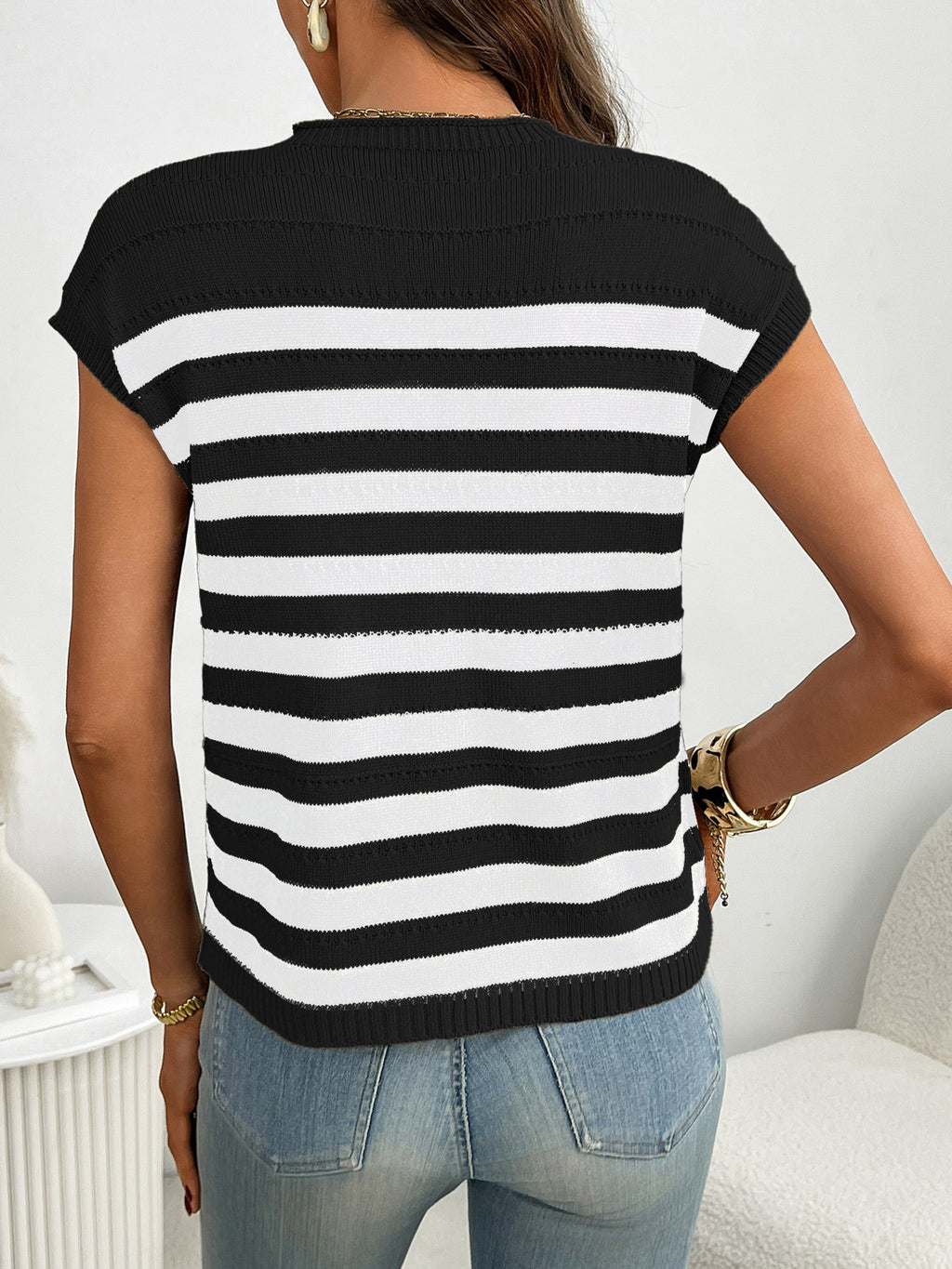 Women's striped knit cap sleeve sweater with pocket detail, featuring a trendy and comfortable design by Trendsi.