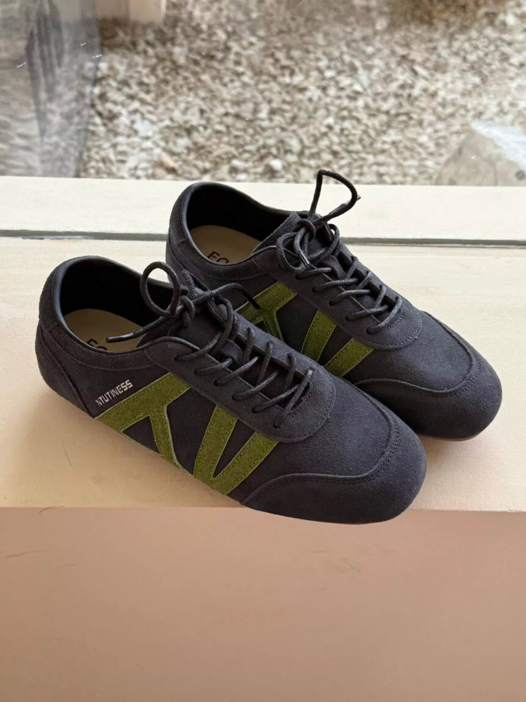 Women's casual suede and nylon lace-up flat sneakers with white soles, stylish and comfortable Trendsi shoe for everyday wear.