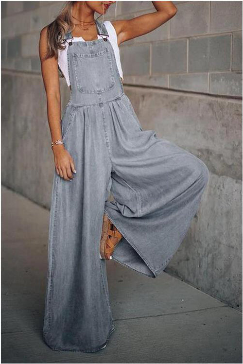 Light gray denim wide-leg overalls paired with a white tank top, styled for a casual, relaxed look.