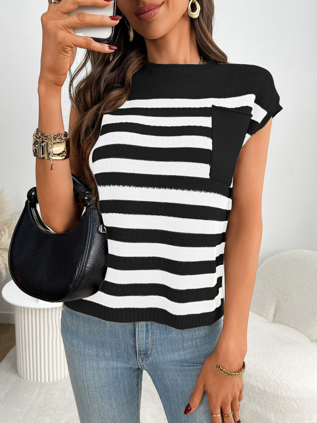 Women's striped knit cap sleeve sweater with pocket detail, stylish and cozy Trendsi fashion top for casual wear.