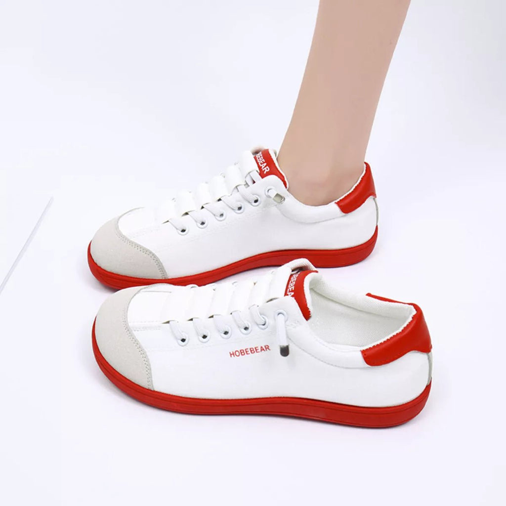 Contrast lace-up casual sneakers made of PU leather and canvas, trendy flats with stylish design and comfortable fit.
