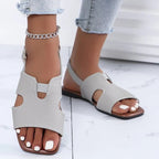Women's chic cut-out open toe flat sandals by Trendsi, featuring stylish design and comfortable summer footwear.