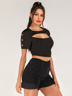 Women's short sleeve cropped tee with grommet cutout details, trendy edgy fashion top by Trendsi.