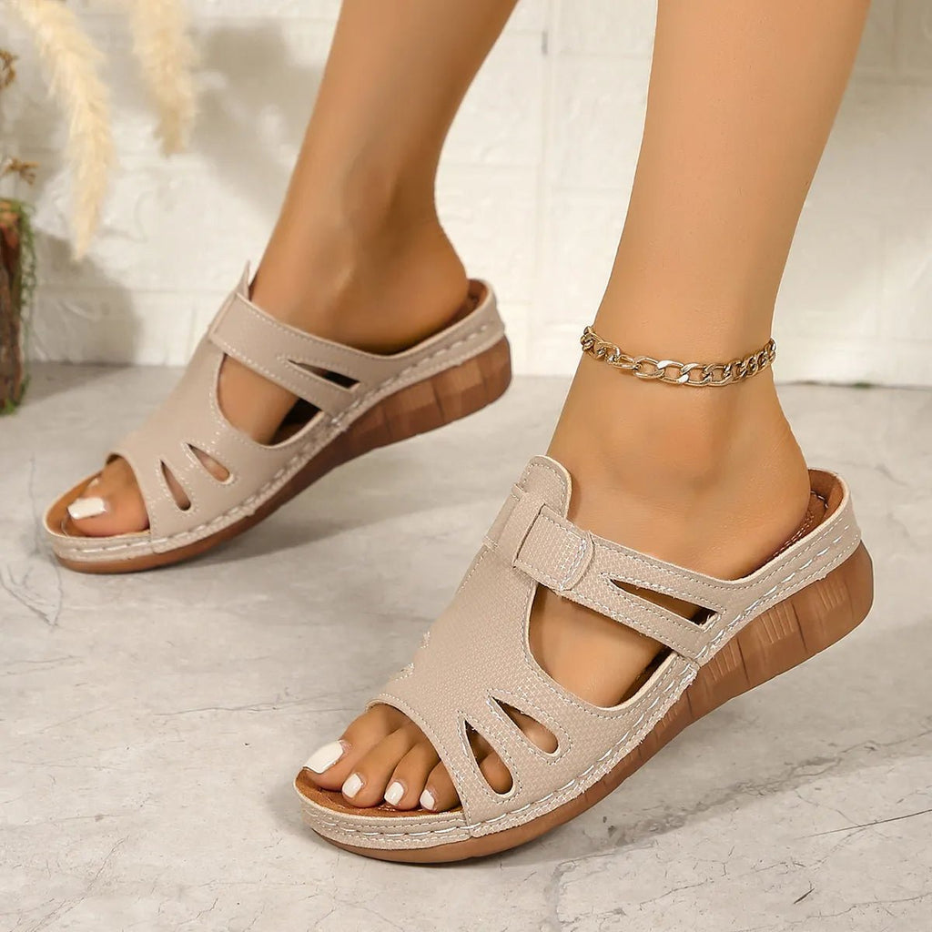 Women's chic faux leather wedge sandals with cutout details and open-toe design from Trendsi.