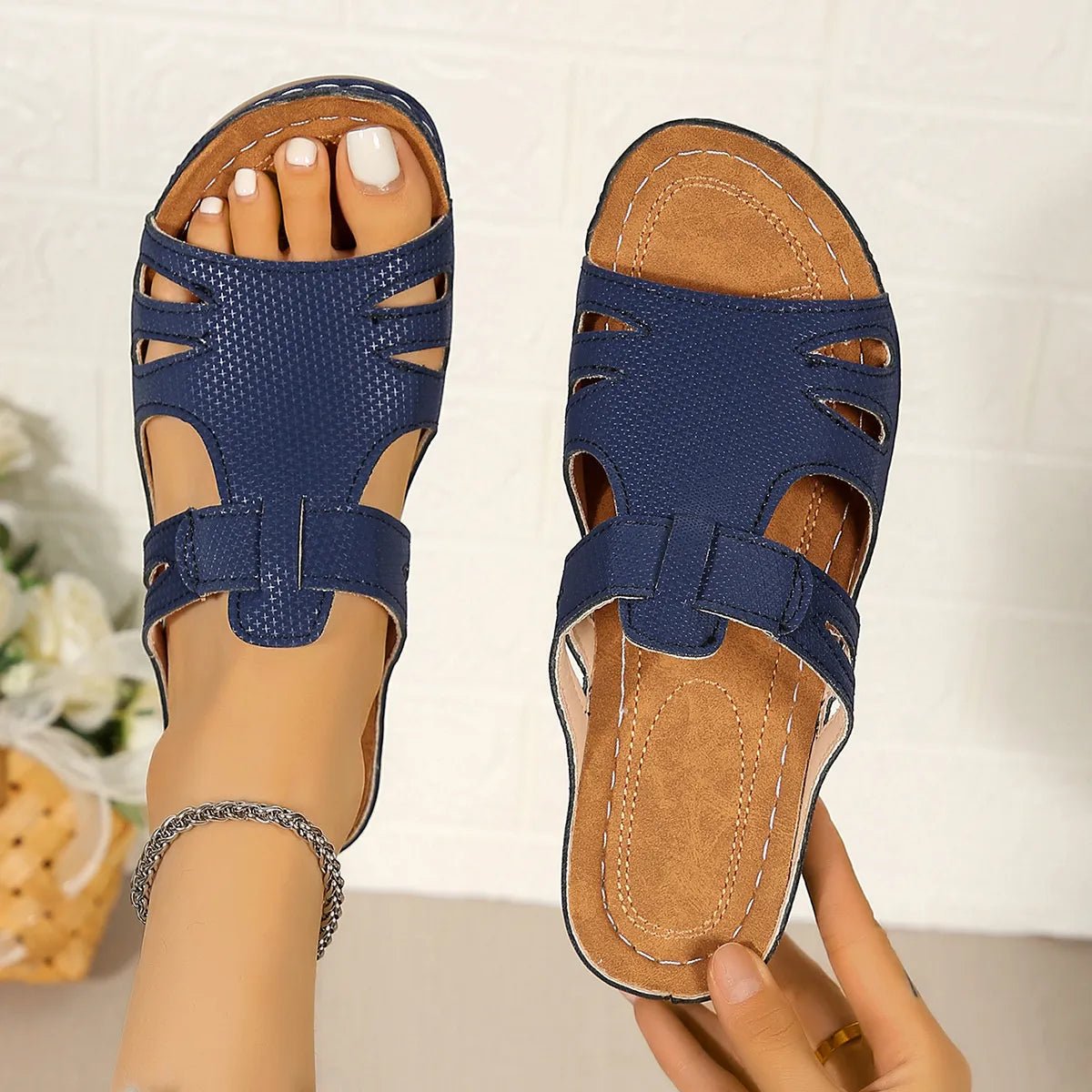 Women's chic faux leather open-toe wedge sandals with stylish cutouts and open-toe design, perfect for trendy summer footwear.