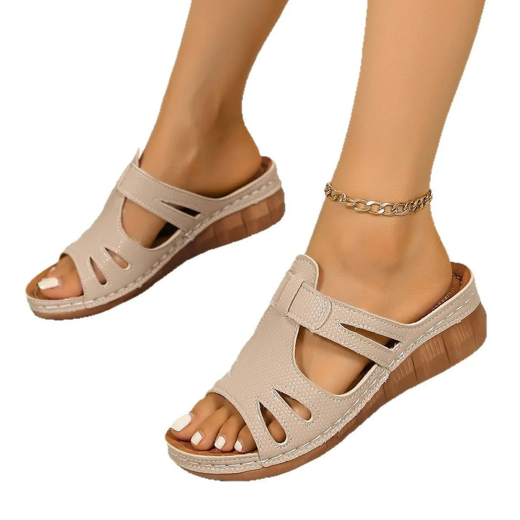Women's chic faux leather wedge sandals with cutout details and open-toe design by Trendsi.