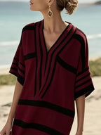 Plus size women's striped half-sleeve midi dress by Trendsi, casual chic everyday wear, featuring a comfortable fit and stylish design.