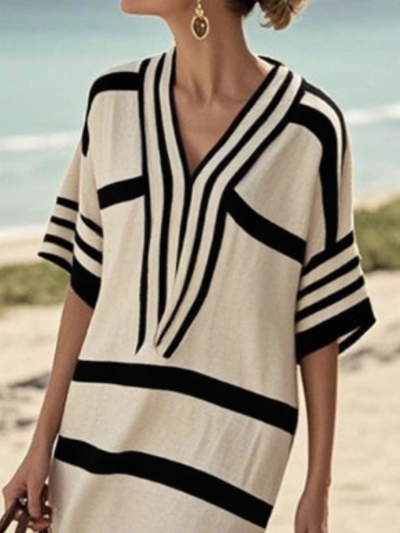 Plus size women's striped midi dress with half-sleeves, casual chic style, featuring a comfortable fit and versatile everyday wear.