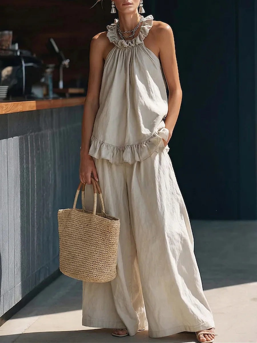 Halterneck loose two-piece pleated casualwear set with asymmetric pockets from FitiqueFit, featuring a stylish and relaxed design.
