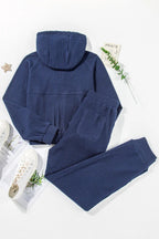 Women's half-zip drawstring hoodie and jogger lounge set, stylish 2-piece sweat suit by Trendsi, perfect for casual wear.