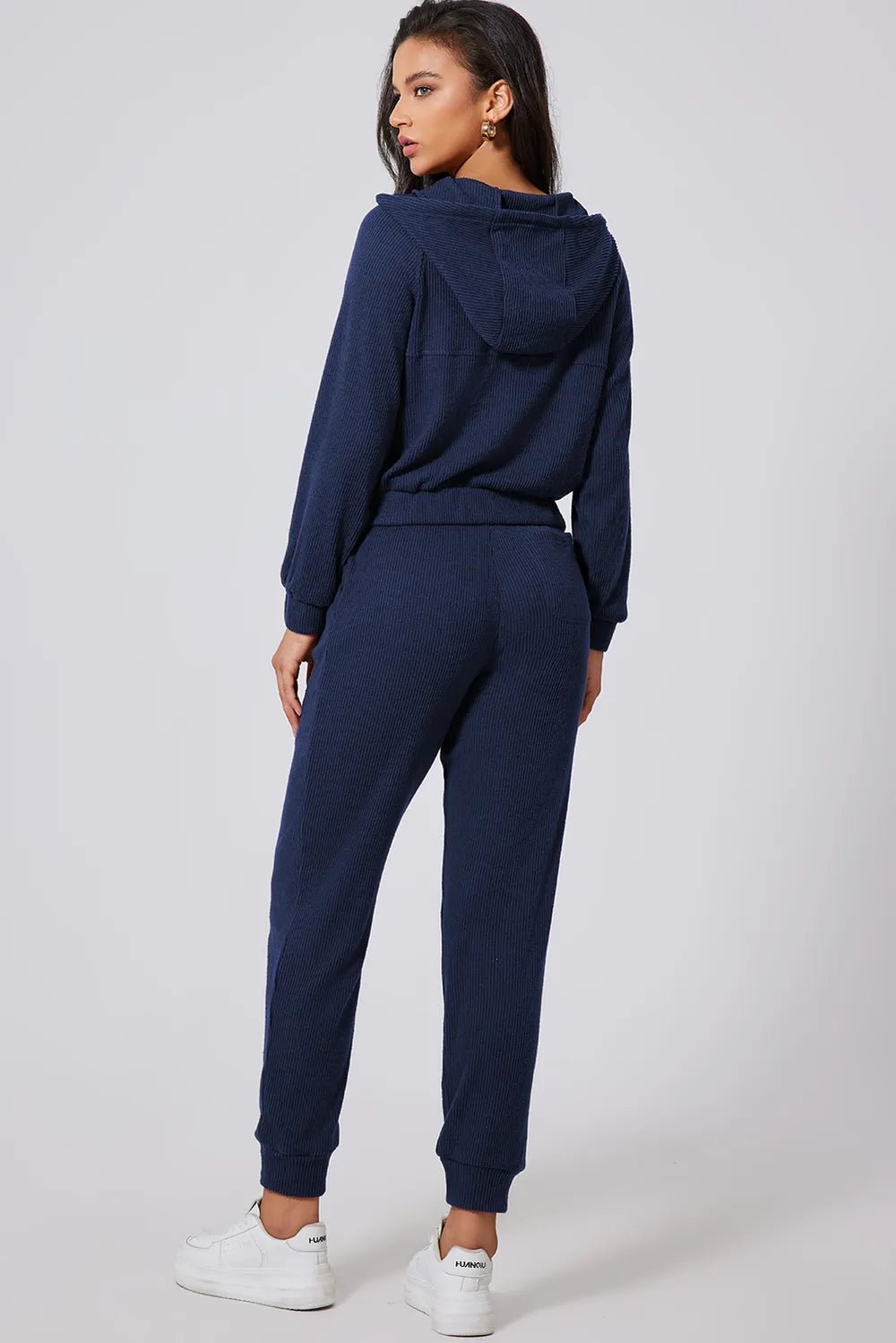 Women's half-zip drawstring hoodie and jogger lounge set, trendy active 2-piece sweat suit by Trendsi.