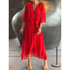Plush Fashion Hub batwing sleeve V-neck midi dress with tied irregular hem, flowing fairy dress style, in soft fabric.