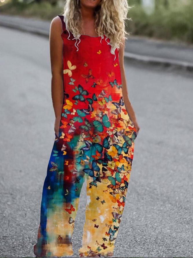 Sleeveless jumpsuit with a vibrant red, blue, and yellow ombre butterfly print and relaxed, wide-leg fit.
