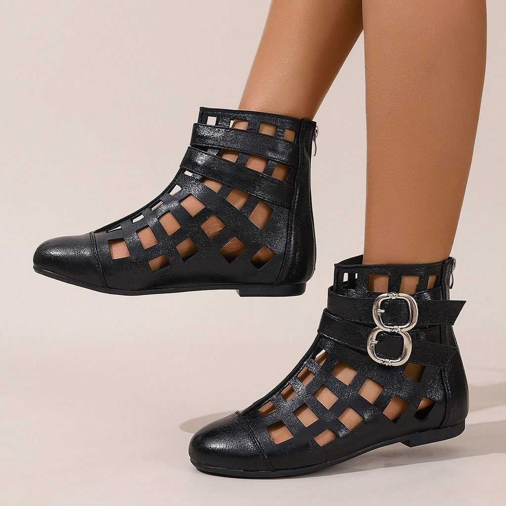 Women's round toe cutout ankle boots by Trendsi with stylish design, low heel, and comfortable fit, perfect for casual or dressy outfits.