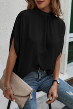 Elegant tie-back half-sleeve blouse with side slit from Trendsi, featuring a stylish fit and lightweight fabric.