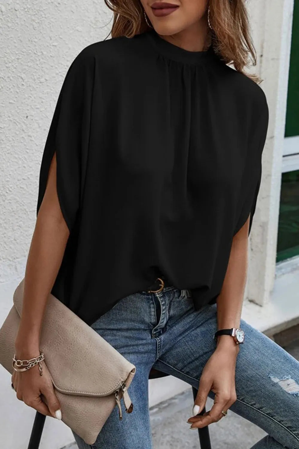 Elegant tie-back half-sleeve blouse with side slit from Trendsi, featuring a stylish fit and lightweight fabric.