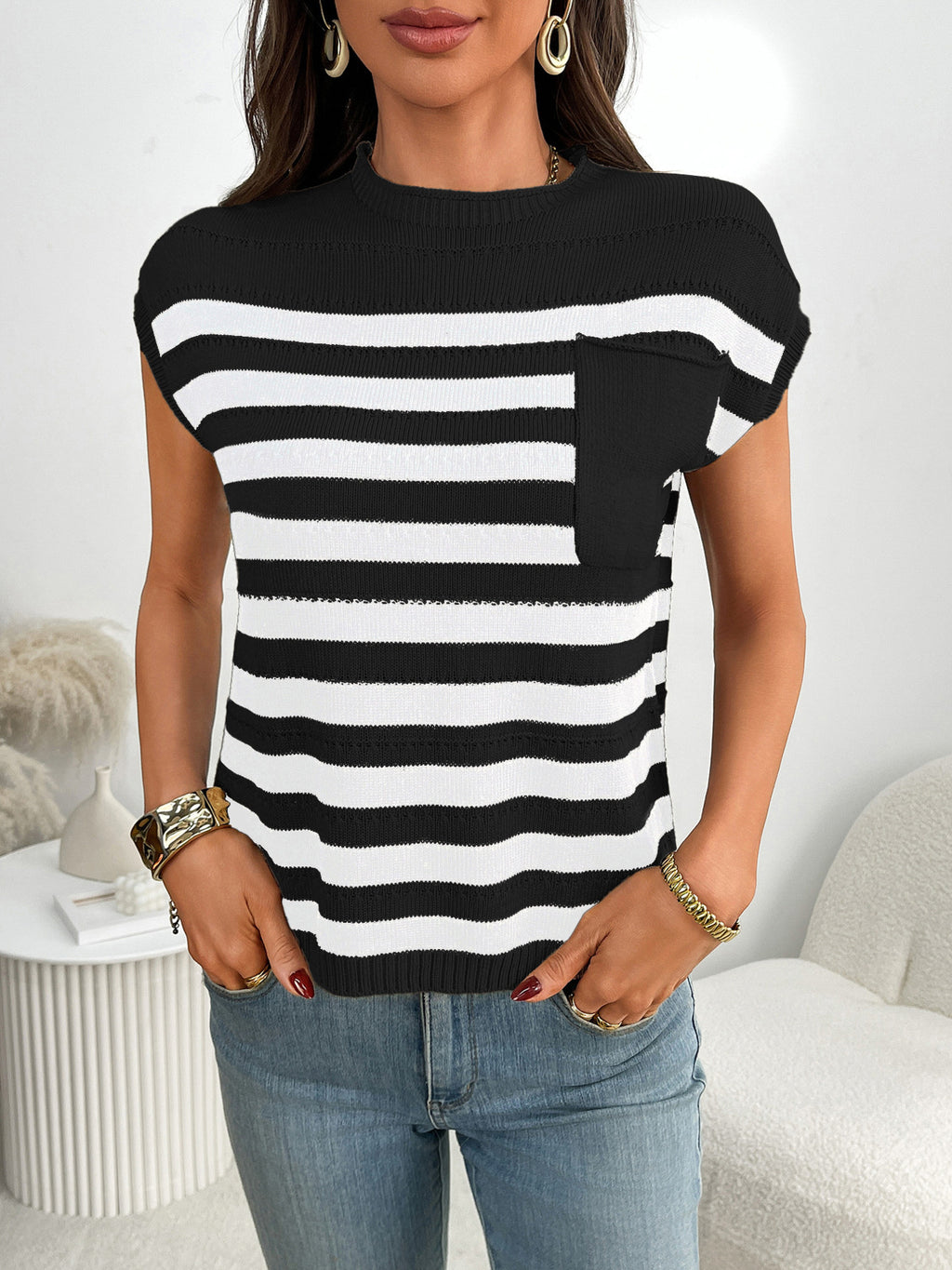 Women's striped knit cap sleeve sweater with pocket detail, trendy and comfortable for casual wear.