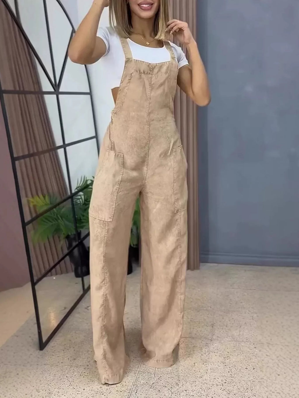 Full size wide-leg denim overalls by Trendsi, featuring a one-piece design with adjustable straps and classic denim fabric.