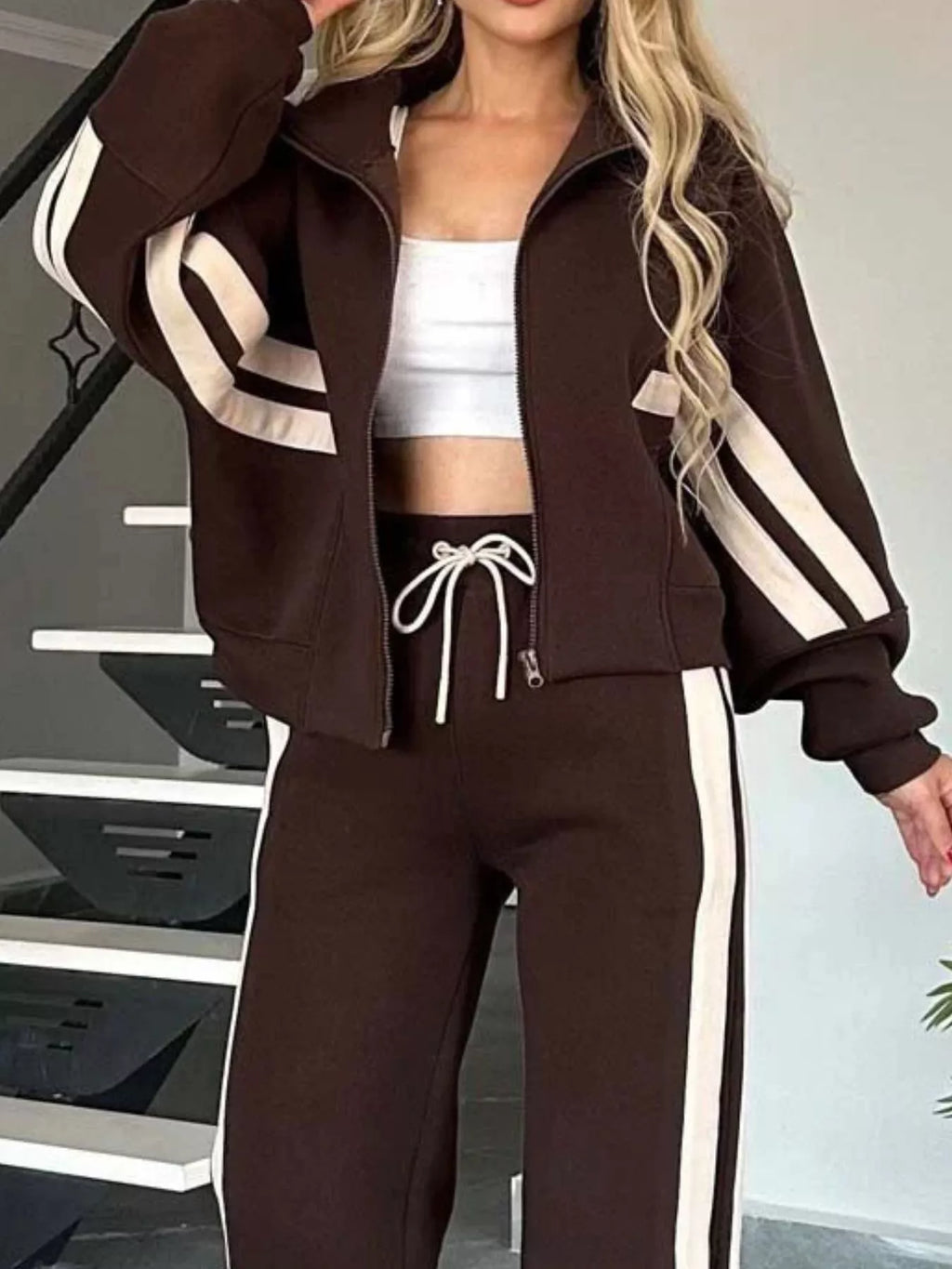 Plus size contrast stripe zip-up jacket and pants activewear set by Plush Fashion Hub, featuring bold stripes and comfortable fit.