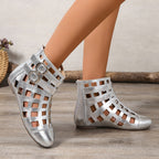Women's round toe cutout ankle boots by Trendsi featuring a stylish low heel and comfortable design, shown in a close-up view.