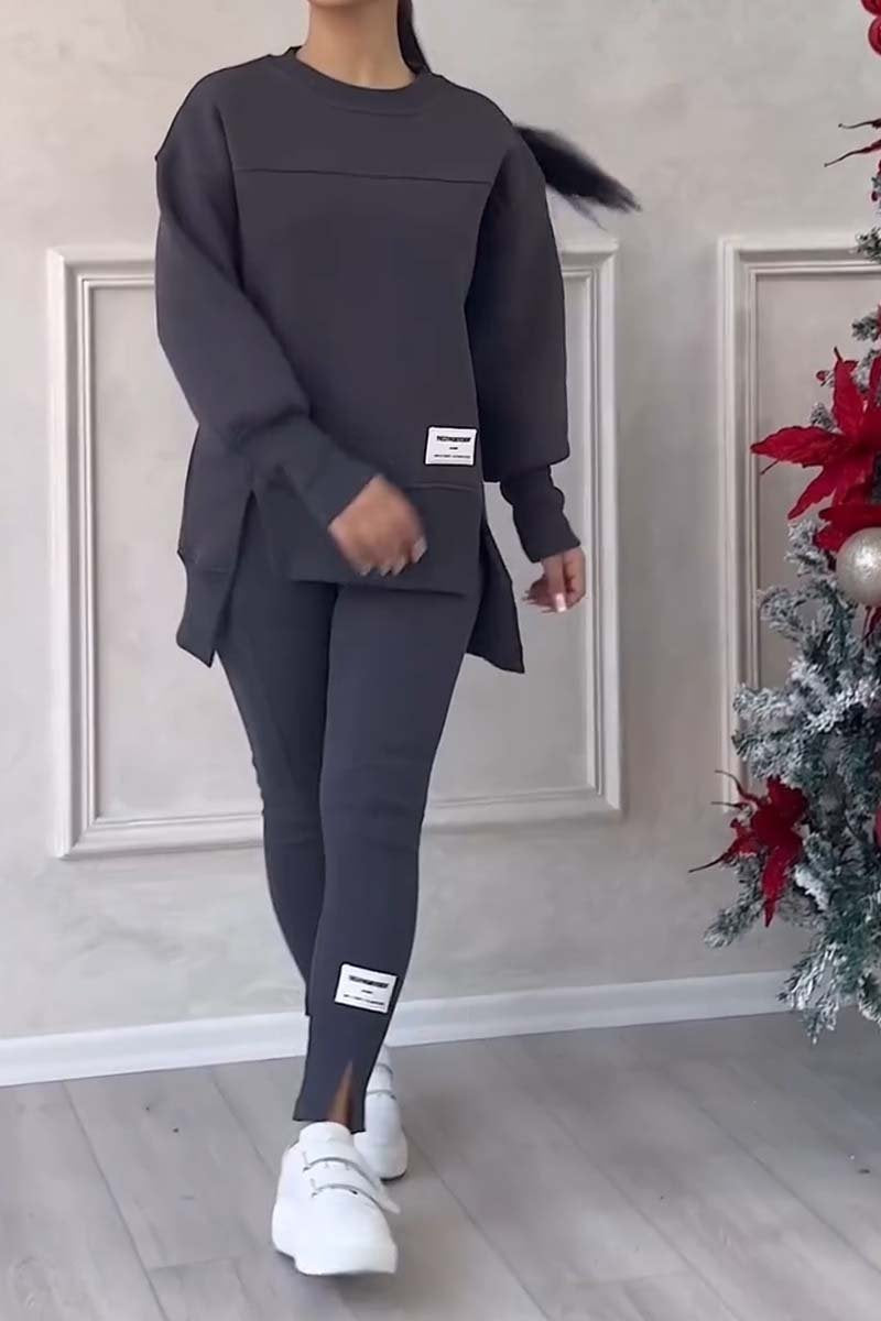 Women's solid color 2-piece casualwear set by FitiqueFit, featuring a relaxed fit top and matching pants.