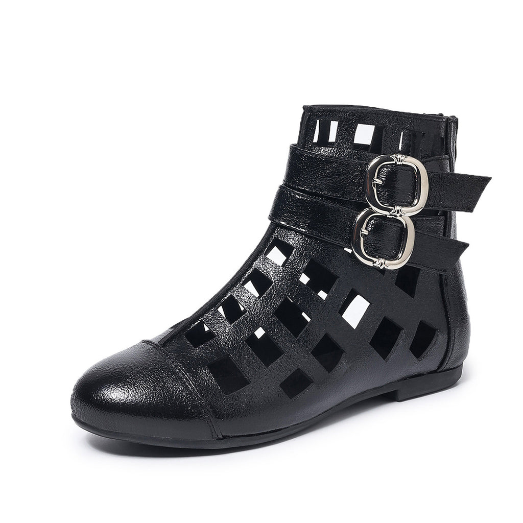 Women's round toe cutout ankle boots by Trendsi, featuring a stylish low heel and comfortable footwear design.