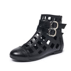 Women's round toe cutout ankle boots by Trendsi, featuring a stylish low heel and comfortable footwear design.