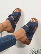 Women's floral crisscross wedge sandals with mid-heel, comfortable summer shoes by Trendsi, featuring a stylish floral design.