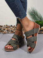 Women's floral crisscross wedge sandals by Trendsi, featuring comfortable mid-heel design and summer-ready style.