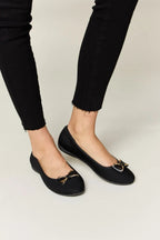 Women's metal buckle flat loafers by Trendsi, featuring a chic design with a metal buckle, comfortable for office and casual wear.
