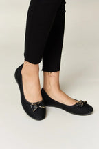 Women's metal buckle flat loafers from Trendsi, featuring a sleek design and comfortable fit for office or casual wear.