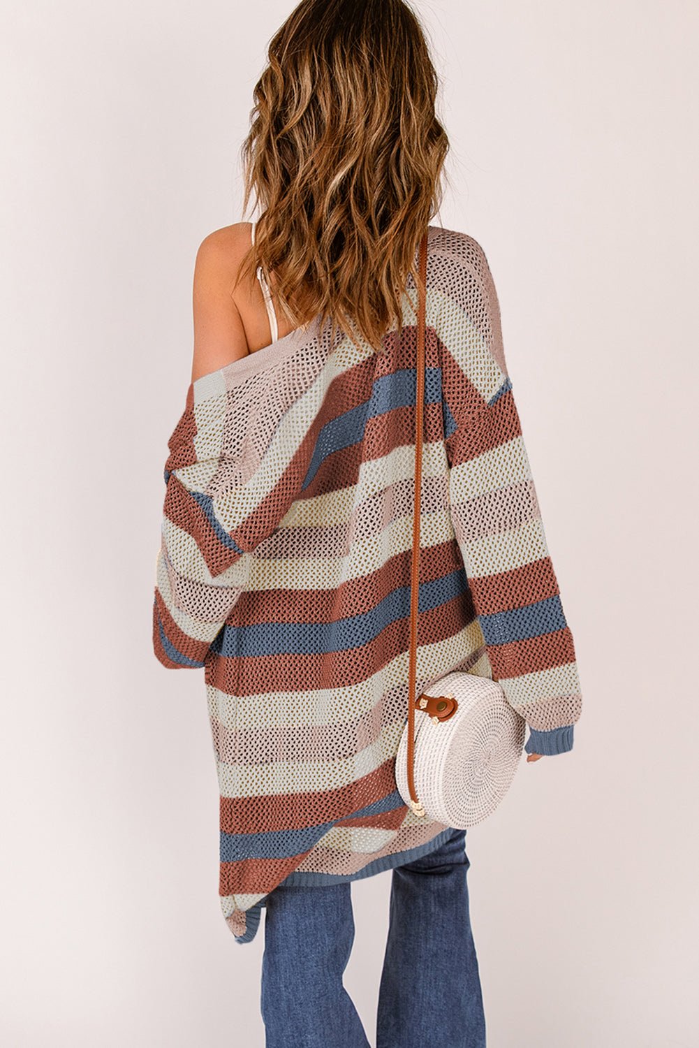 Women's striped openwork long sleeve cardigan, casual knitwear from Trendsi, featuring a lightweight, open-knit design and relaxed fit.